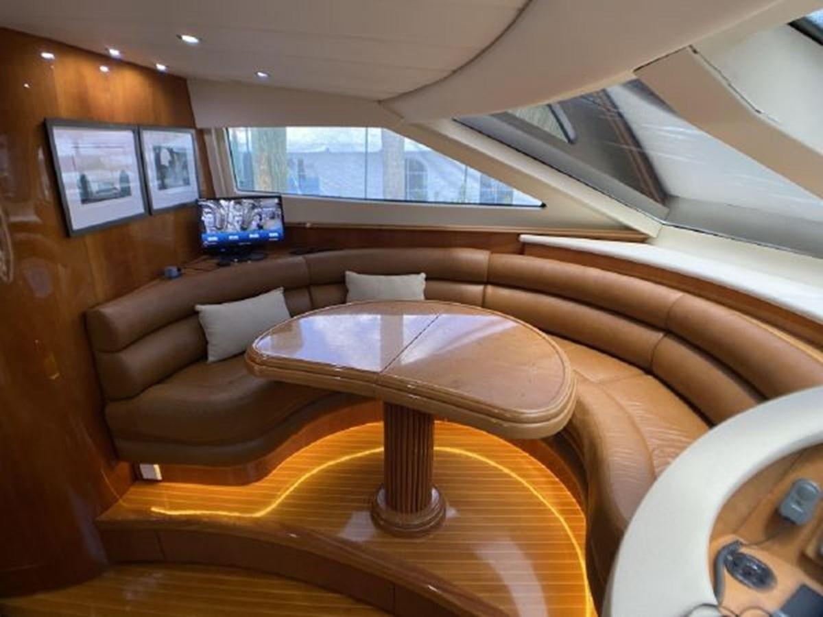 a living room with a couch and a table aboard 85 AZIMUT ULTIMATE Yacht for Sale