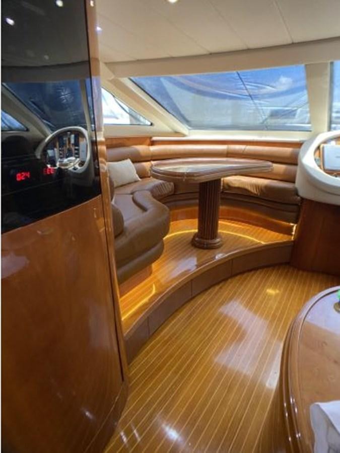 a room with a couch and a table aboard 85 AZIMUT ULTIMATE Yacht for Sale