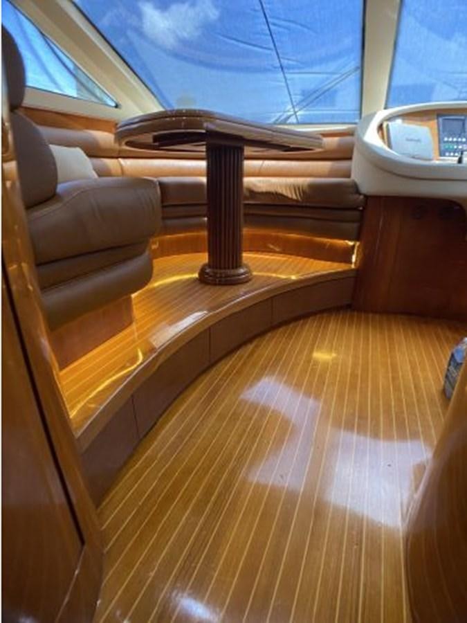 a wooden table with a lamp on it aboard 85 AZIMUT ULTIMATE Yacht for Sale