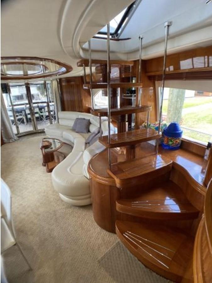 a living room with a fireplace aboard 85 AZIMUT ULTIMATE Yacht for Sale