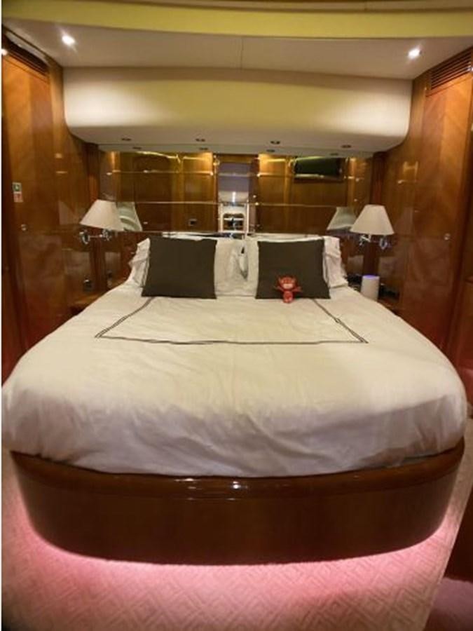 a bed with a pink comforter aboard 85 AZIMUT ULTIMATE Yacht for Sale