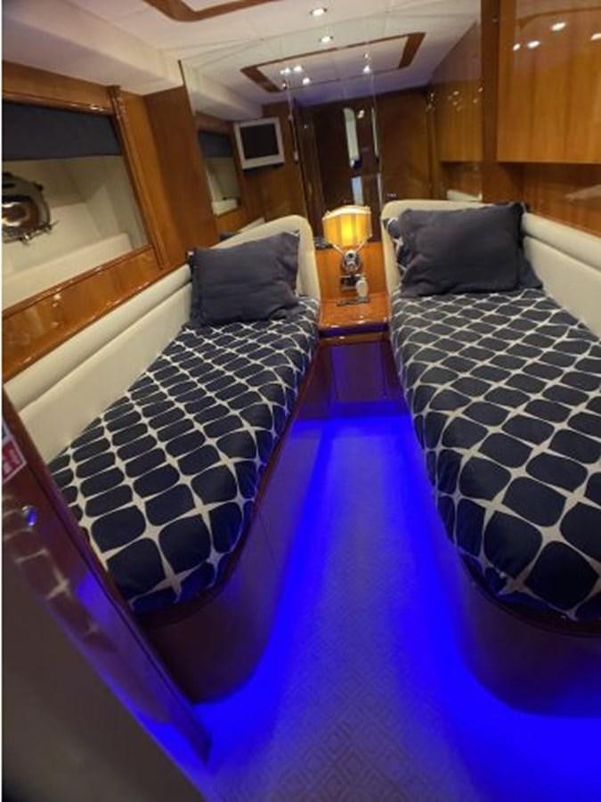 a bed with a blue blanket aboard 85 AZIMUT ULTIMATE Yacht for Sale