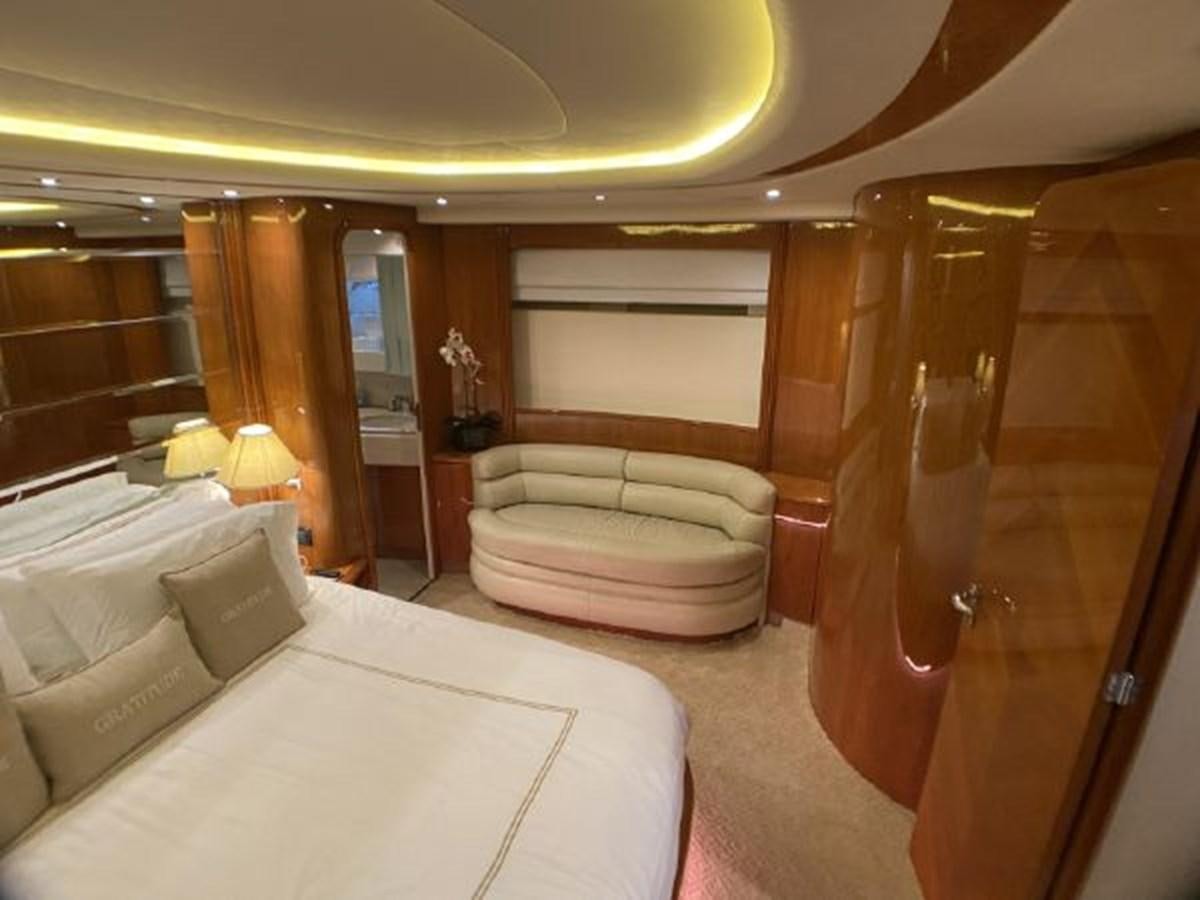 a hotel room with a bed and a large mirror aboard 85 AZIMUT ULTIMATE Yacht for Sale