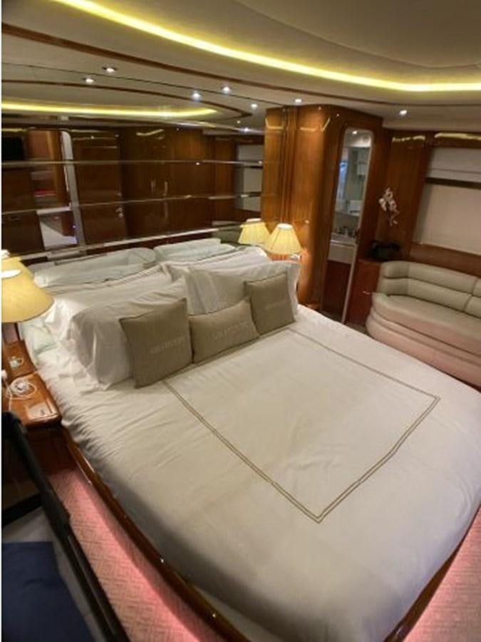 a room with a bed and a couch aboard 85 AZIMUT ULTIMATE Yacht for Sale