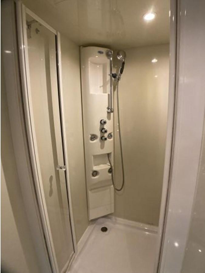 a shower with a glass door aboard 85 AZIMUT ULTIMATE Yacht for Sale