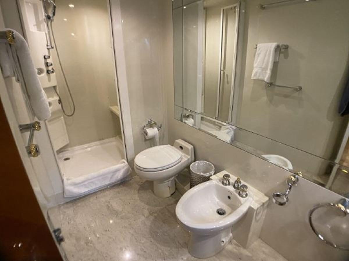 a bathroom with a large mirror aboard 85 AZIMUT ULTIMATE Yacht for Sale