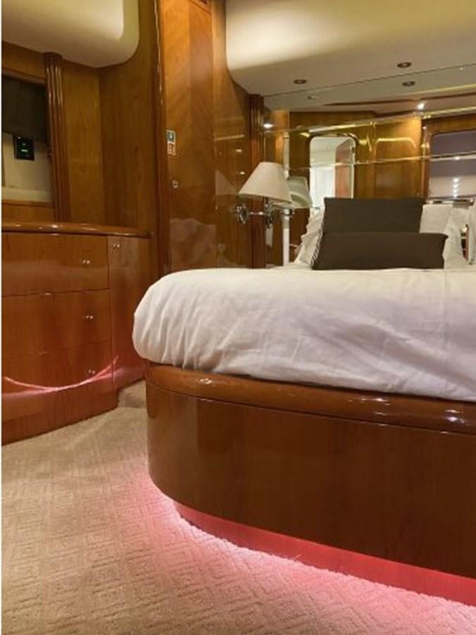 a bedroom with a bed and a lamp aboard 85 AZIMUT ULTIMATE Yacht for Sale