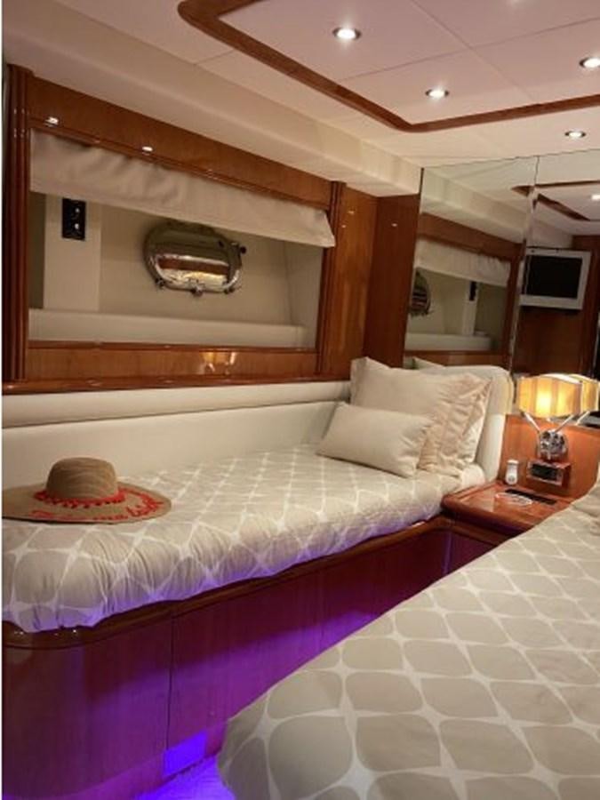 a bed with a blue blanket aboard 85 AZIMUT ULTIMATE Yacht for Sale