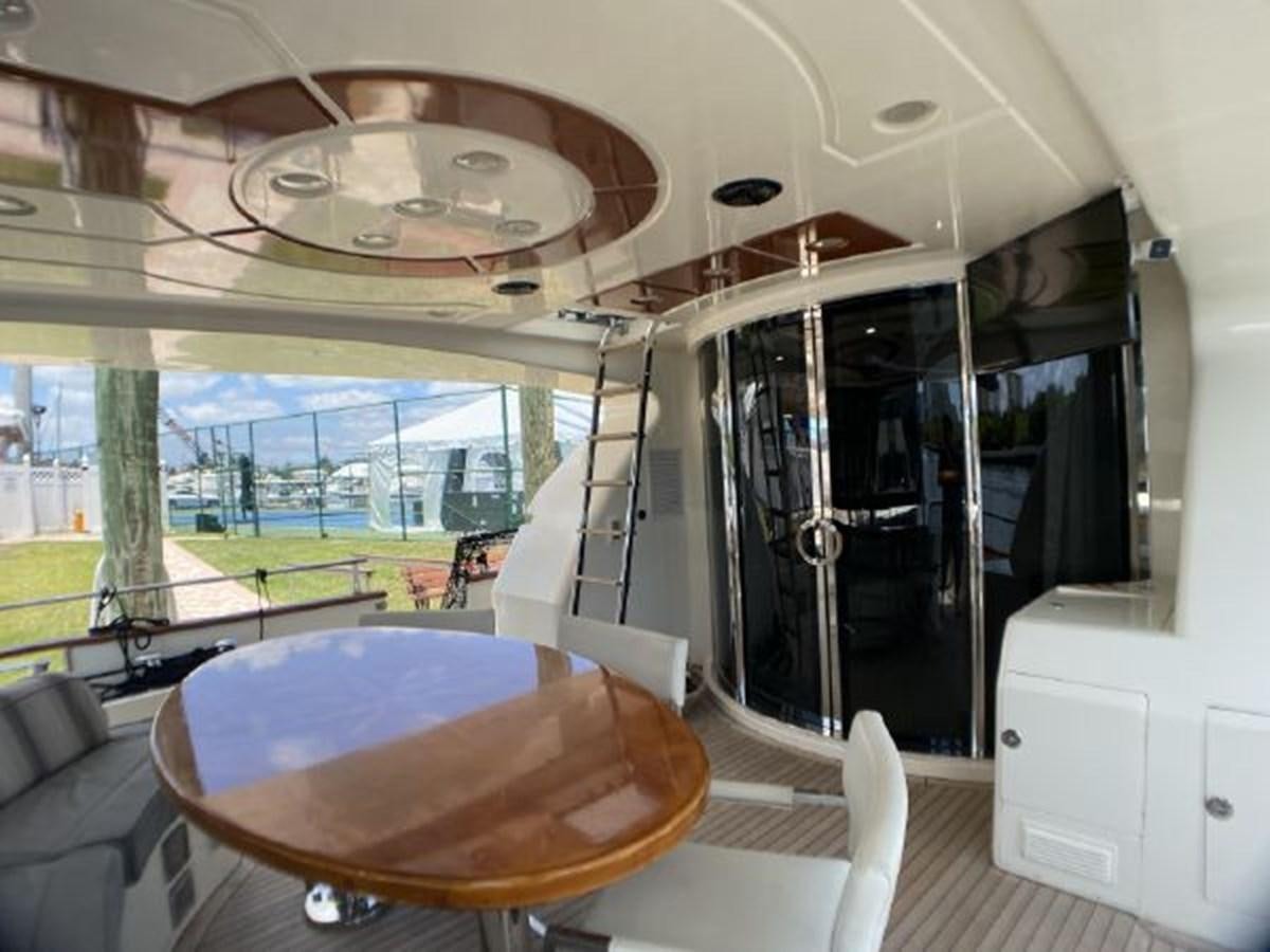 a room with a table and chairs aboard 85 AZIMUT ULTIMATE Yacht for Sale
