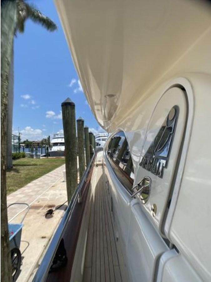 a cat sitting on a car aboard 85 AZIMUT ULTIMATE Yacht for Sale
