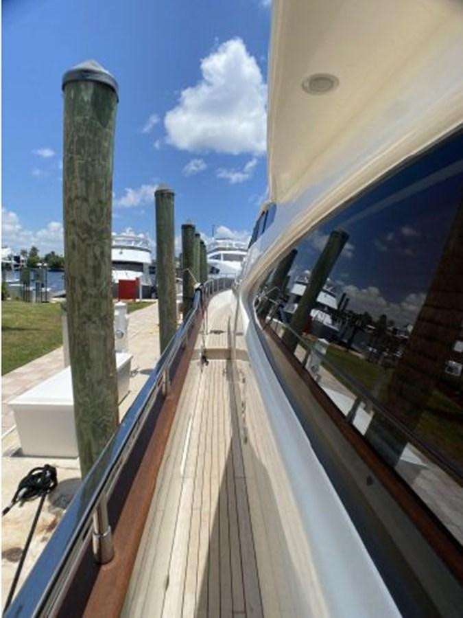 a deck with a railing and a building in the background aboard 85 AZIMUT ULTIMATE Yacht for Sale