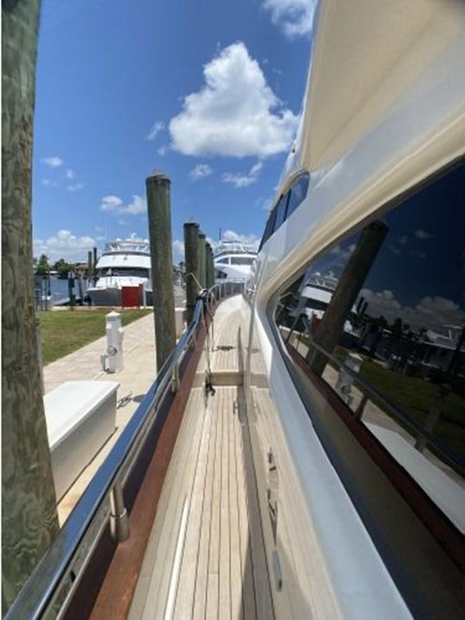 a deck with a railing and a person standing on it aboard 85 AZIMUT ULTIMATE Yacht for Sale