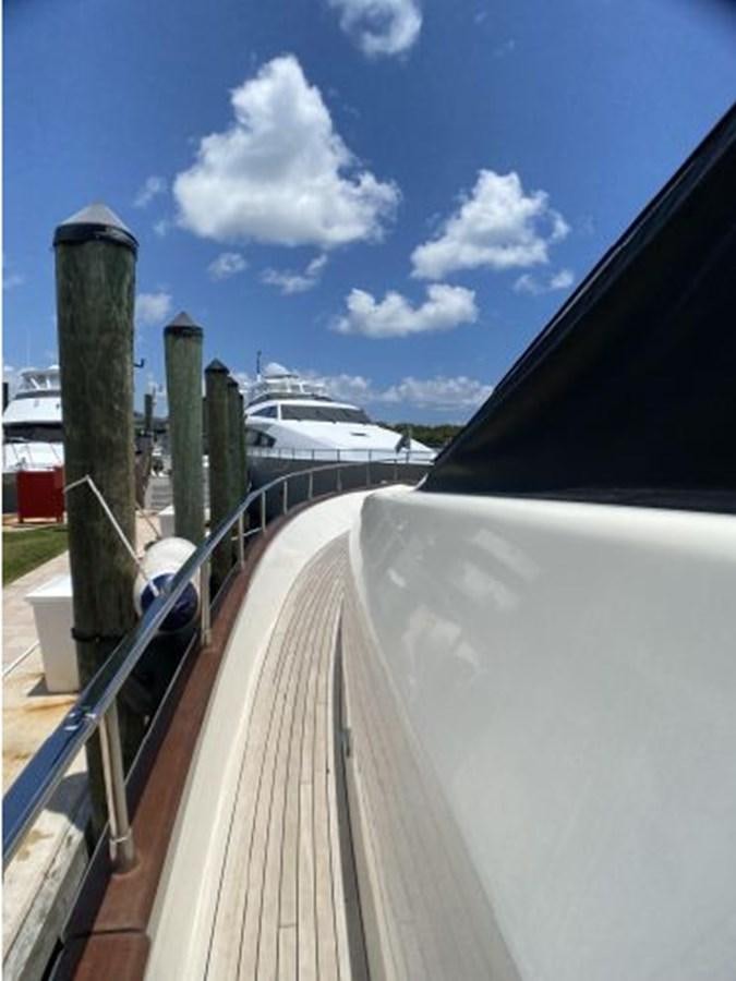 a deck with a railing and a ship in the background aboard 85 AZIMUT ULTIMATE Yacht for Sale