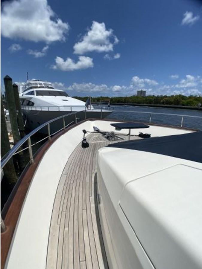 a deck with a boat and a bridge aboard 85 AZIMUT ULTIMATE Yacht for Sale