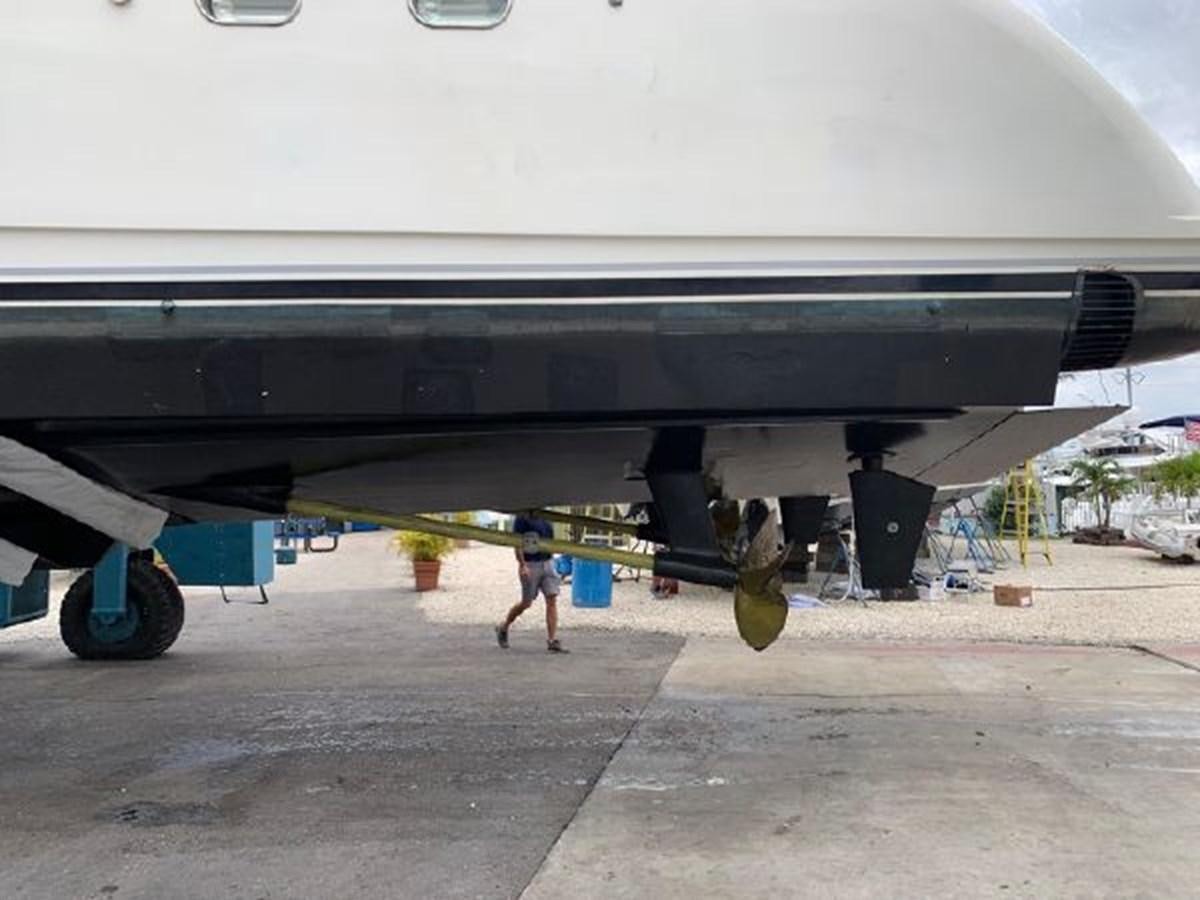 a person walking under a plane aboard 85 AZIMUT ULTIMATE Yacht for Sale
