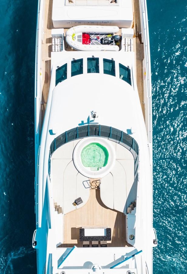 a rocket with a green circle on the front aboard LADY L Yacht for Sale