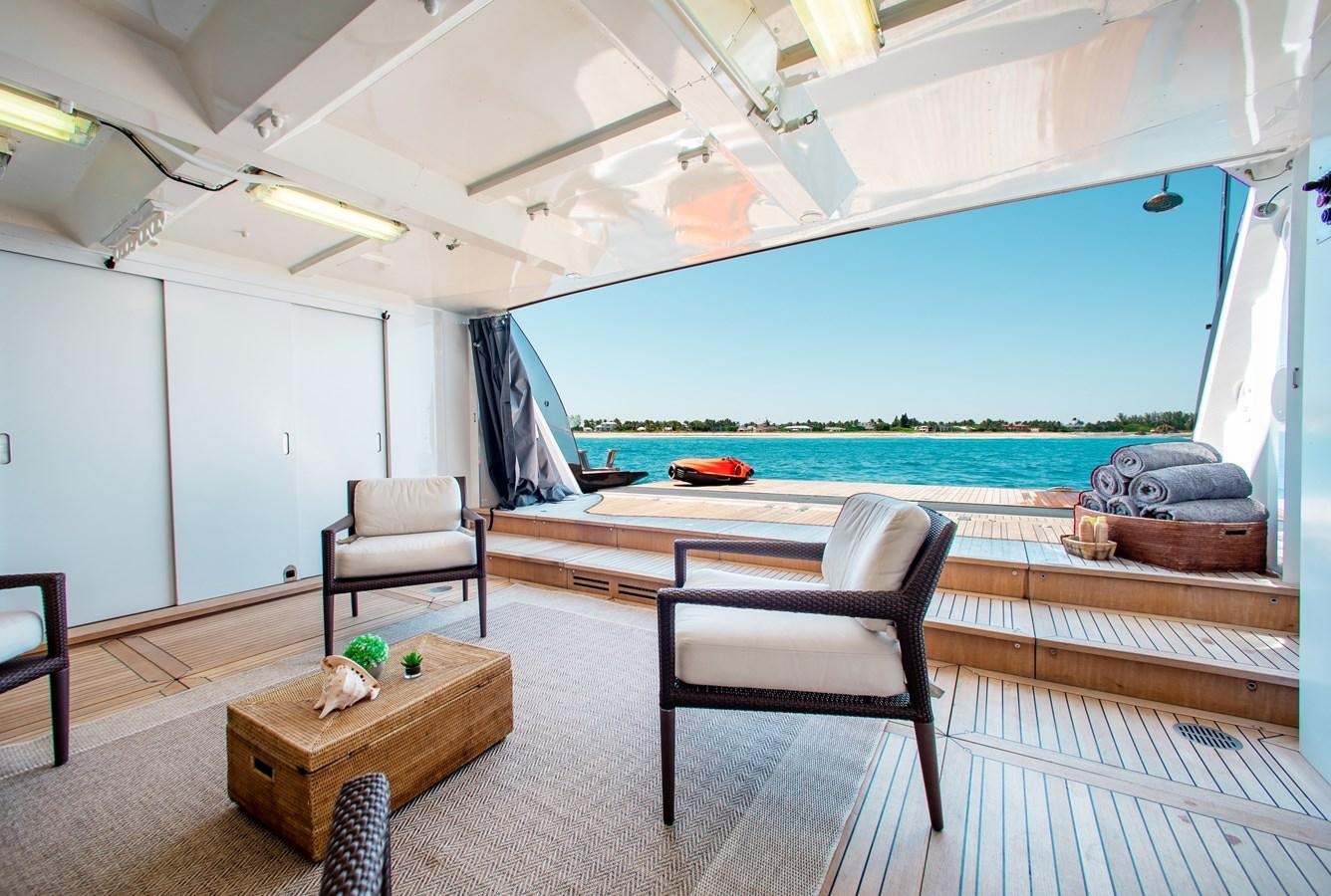 a room with a table and chairs aboard LADY L Yacht for Charter