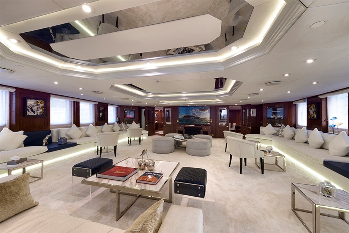 a large room with a couch and a table aboard CHAKRA Yacht for Charter