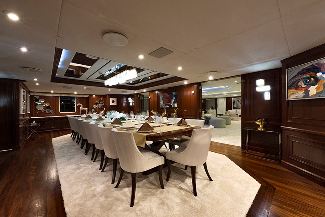 a large dining room with a table and chairs aboard CHAKRA Yacht for Charter