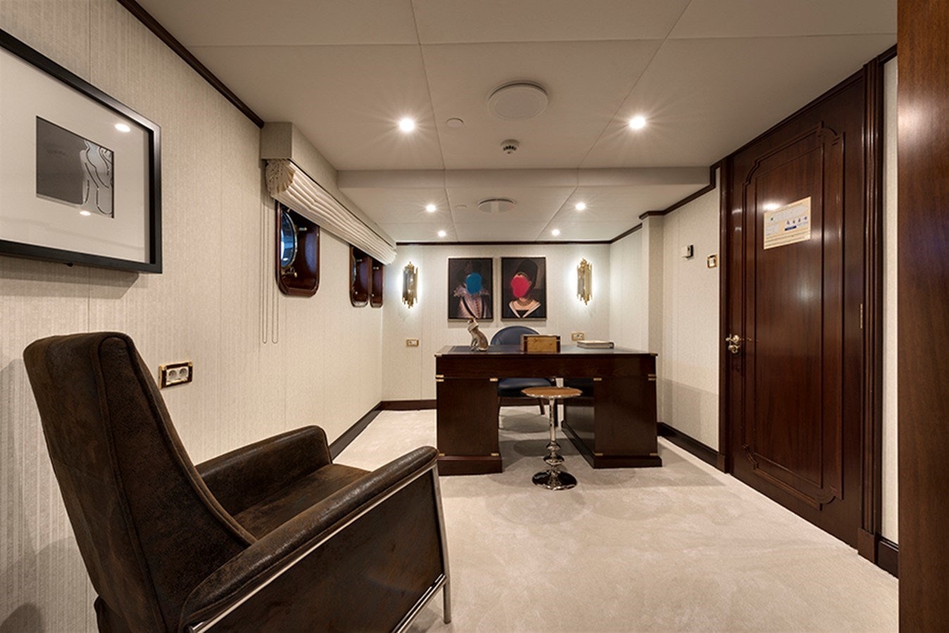 a room with a desk and a chair aboard CHAKRA Yacht for Charter