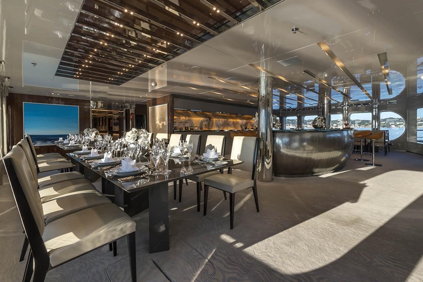 a room with a table and chairs aboard MARQUISE Yacht for Charter
