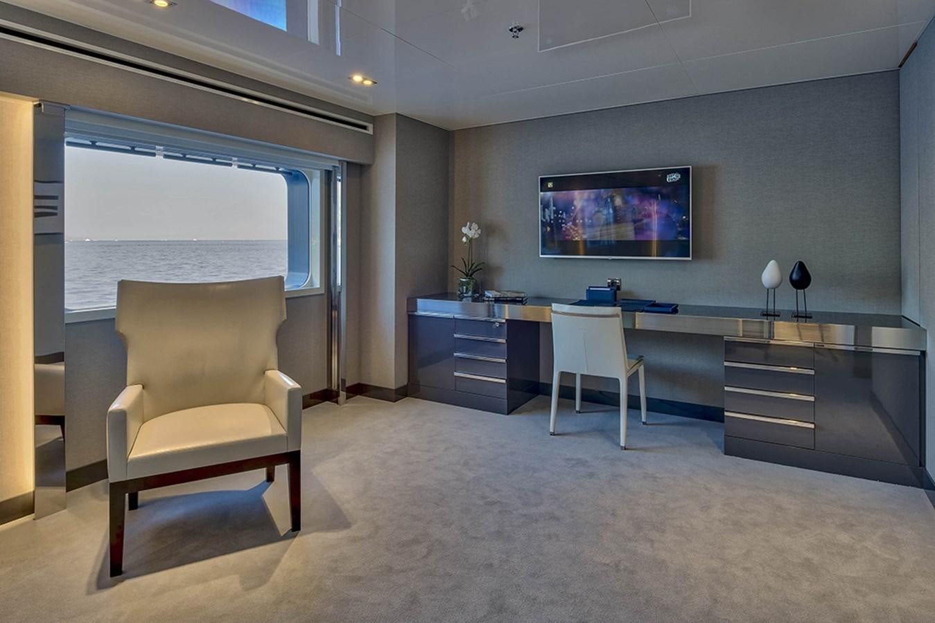 a room with a desk and chairs aboard MARQUISE Yacht for Charter