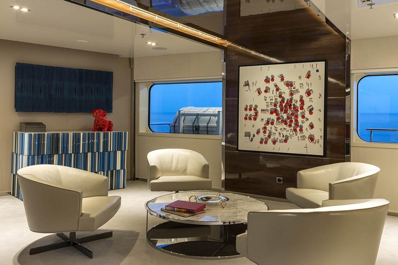 a room with a couch and a tv aboard MARQUISE Yacht for Charter