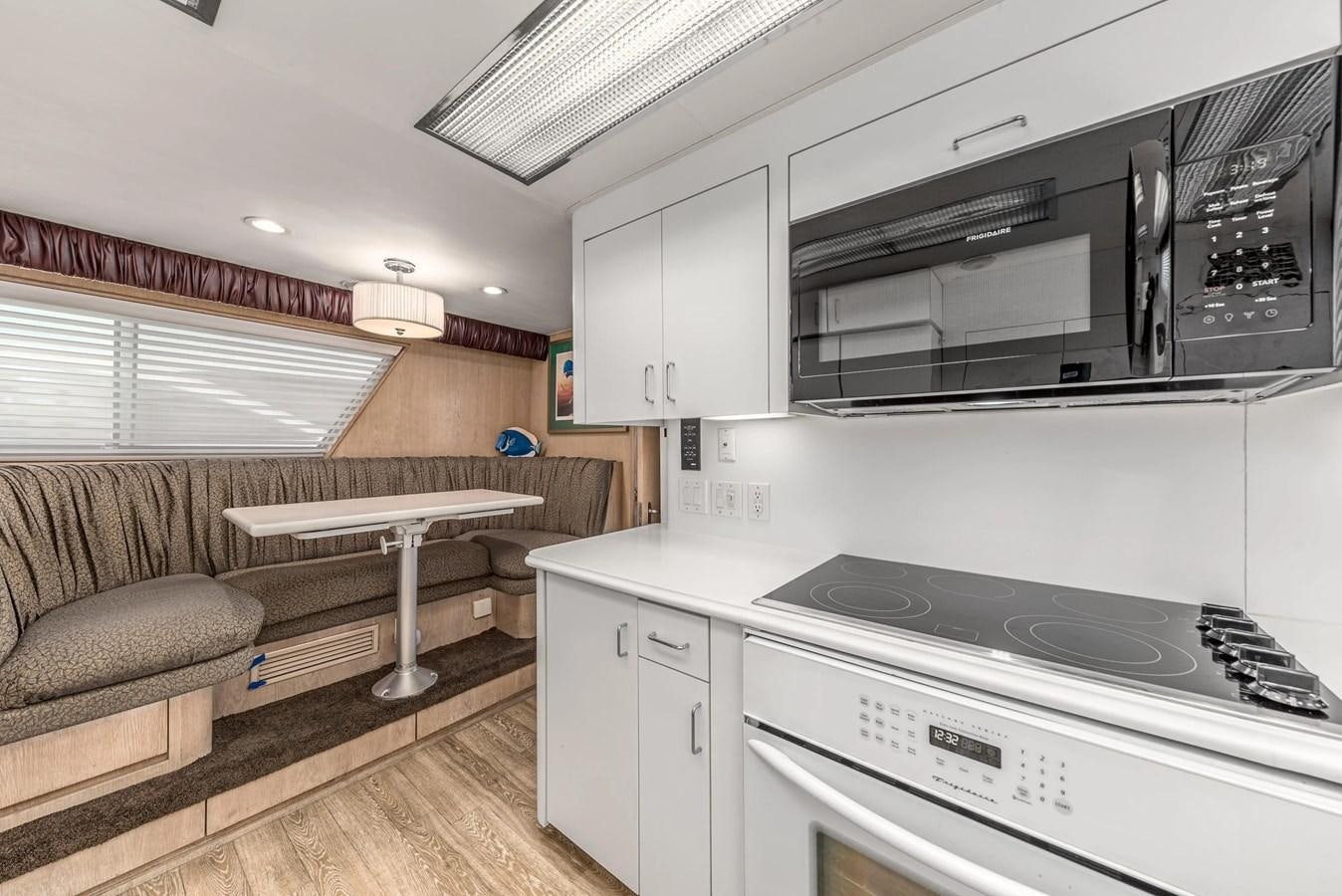 a kitchen with a couch and a table aboard KALEVALA Yacht for Sale