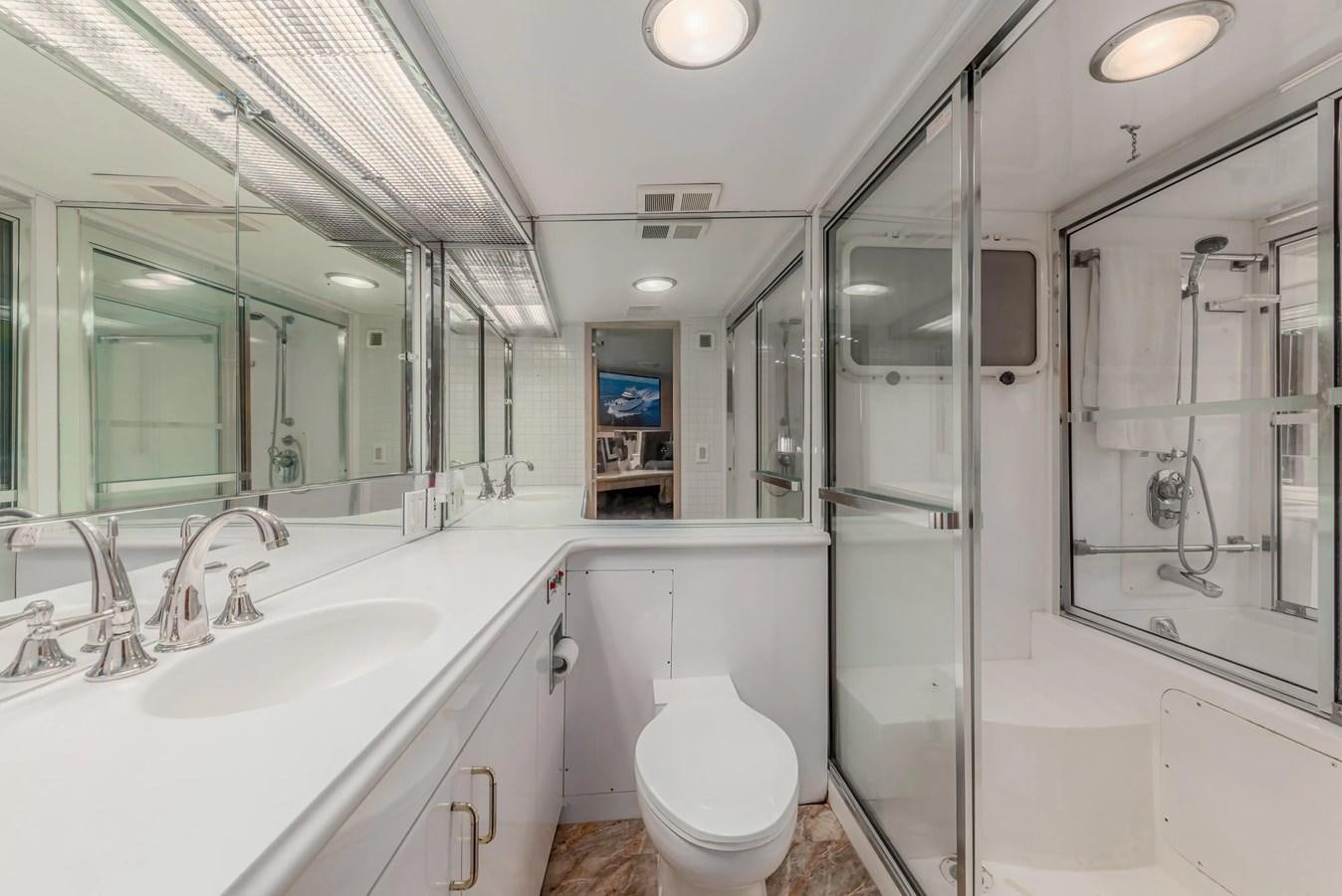 a bathroom with a glass shower aboard KALEVALA Yacht for Sale