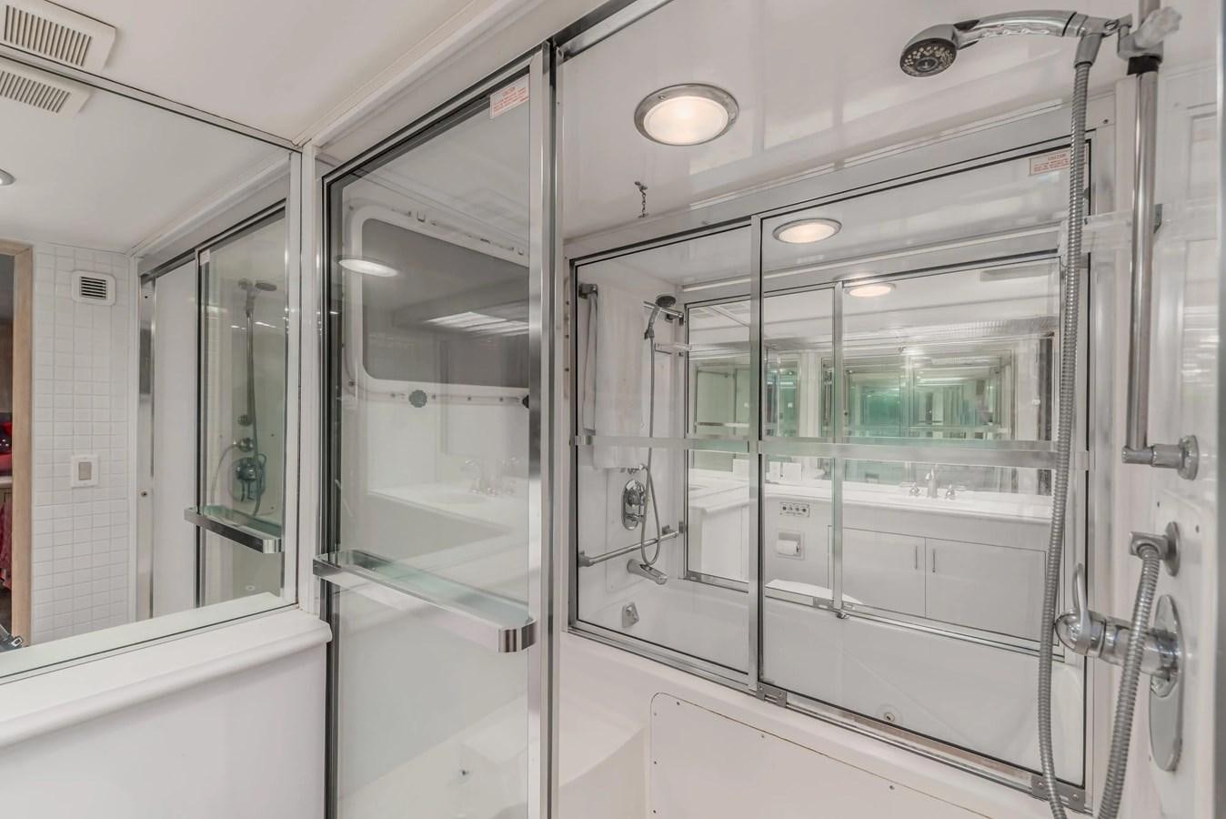 a bathroom with glass doors aboard KALEVALA Yacht for Sale