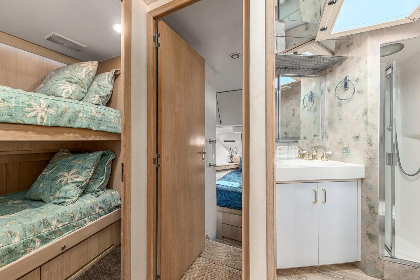 a bedroom with a bed and a closet aboard KALEVALA Yacht for Sale