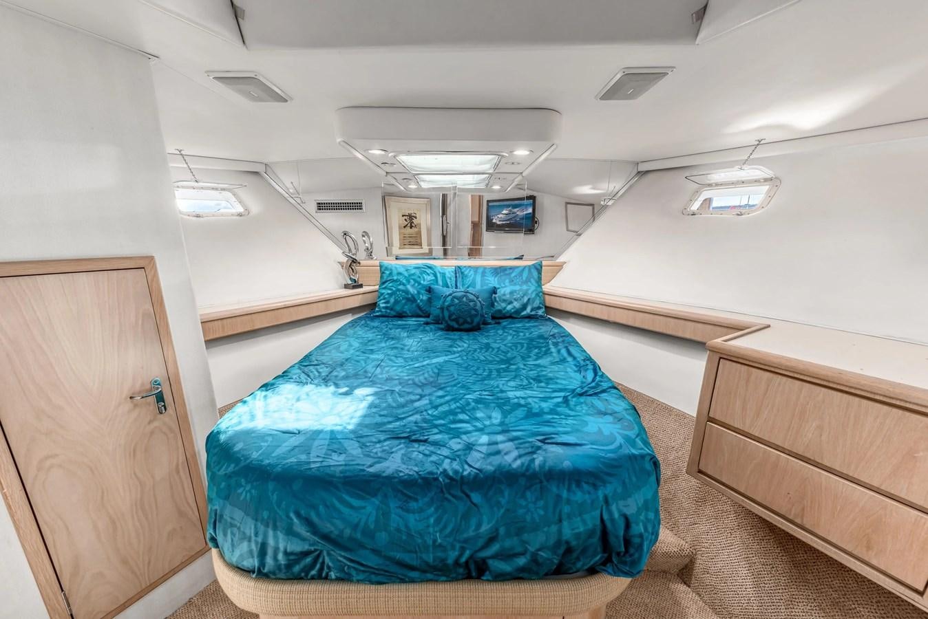a room with a bed and a desk aboard KALEVALA Yacht for Sale