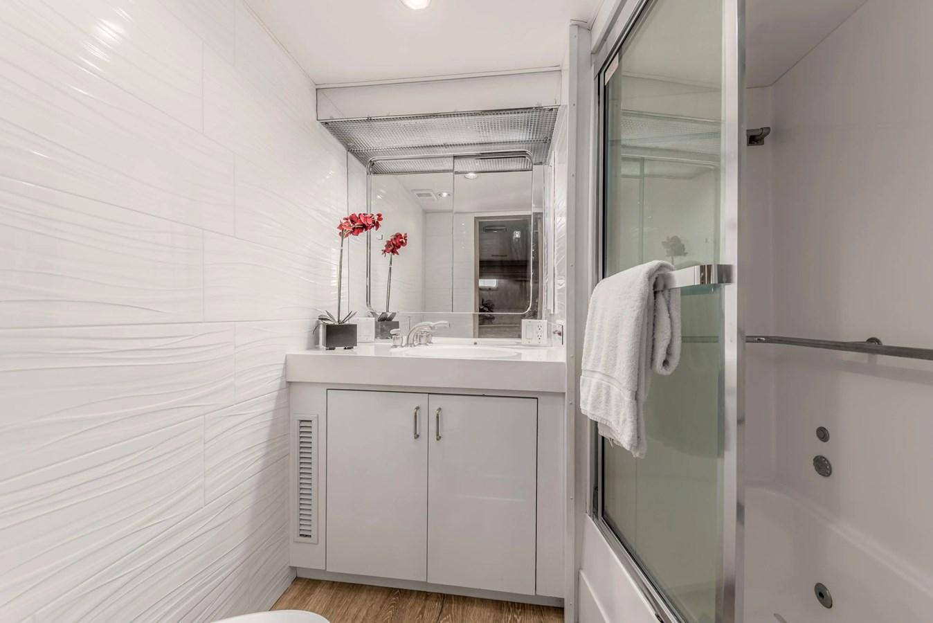 a bathroom with a sink and a mirror aboard KALEVALA Yacht for Sale