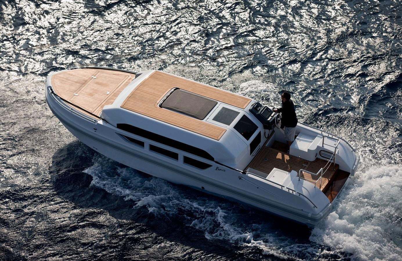 a person standing on a boat on the beach aboard SOUNDWAVE Yacht for Sale