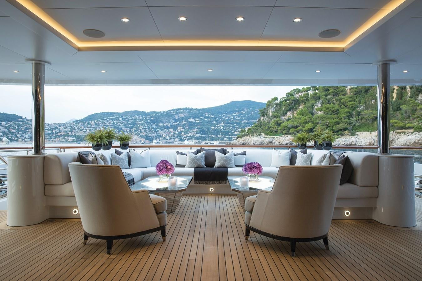 a room with a table and chairs aboard SOUNDWAVE Yacht for Sale