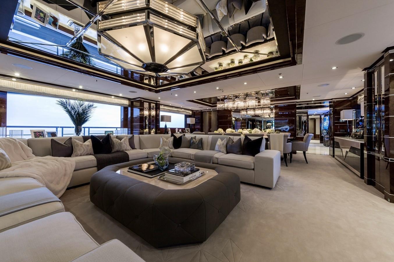 a living room with a large sofa aboard SOUNDWAVE Yacht for Sale