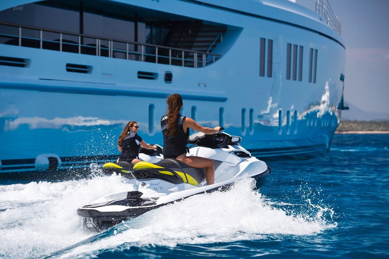 two women on a jet ski aboard SOUNDWAVE Yacht for Sale