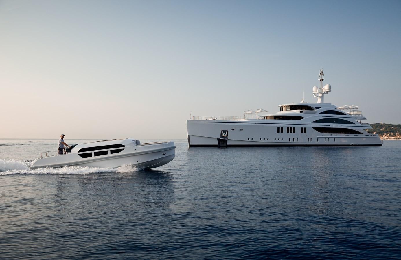 a couple of boats on the water aboard SOUNDWAVE Yacht for Sale