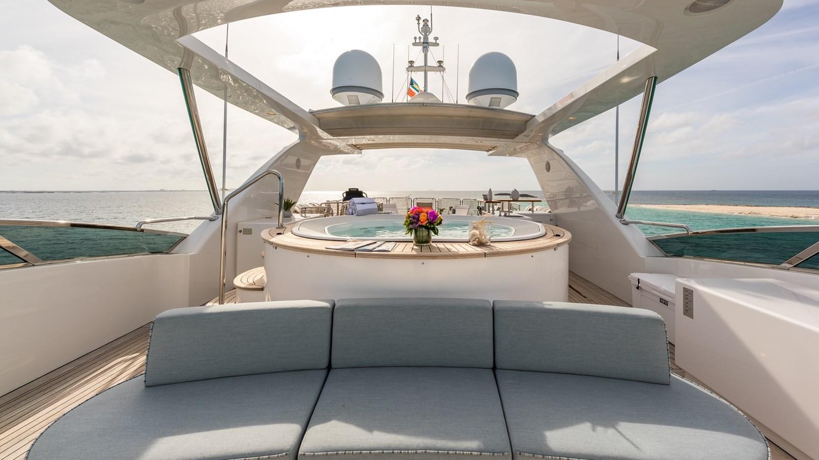 a boat with a table and chairs aboard NAMASTE Yacht for Sale