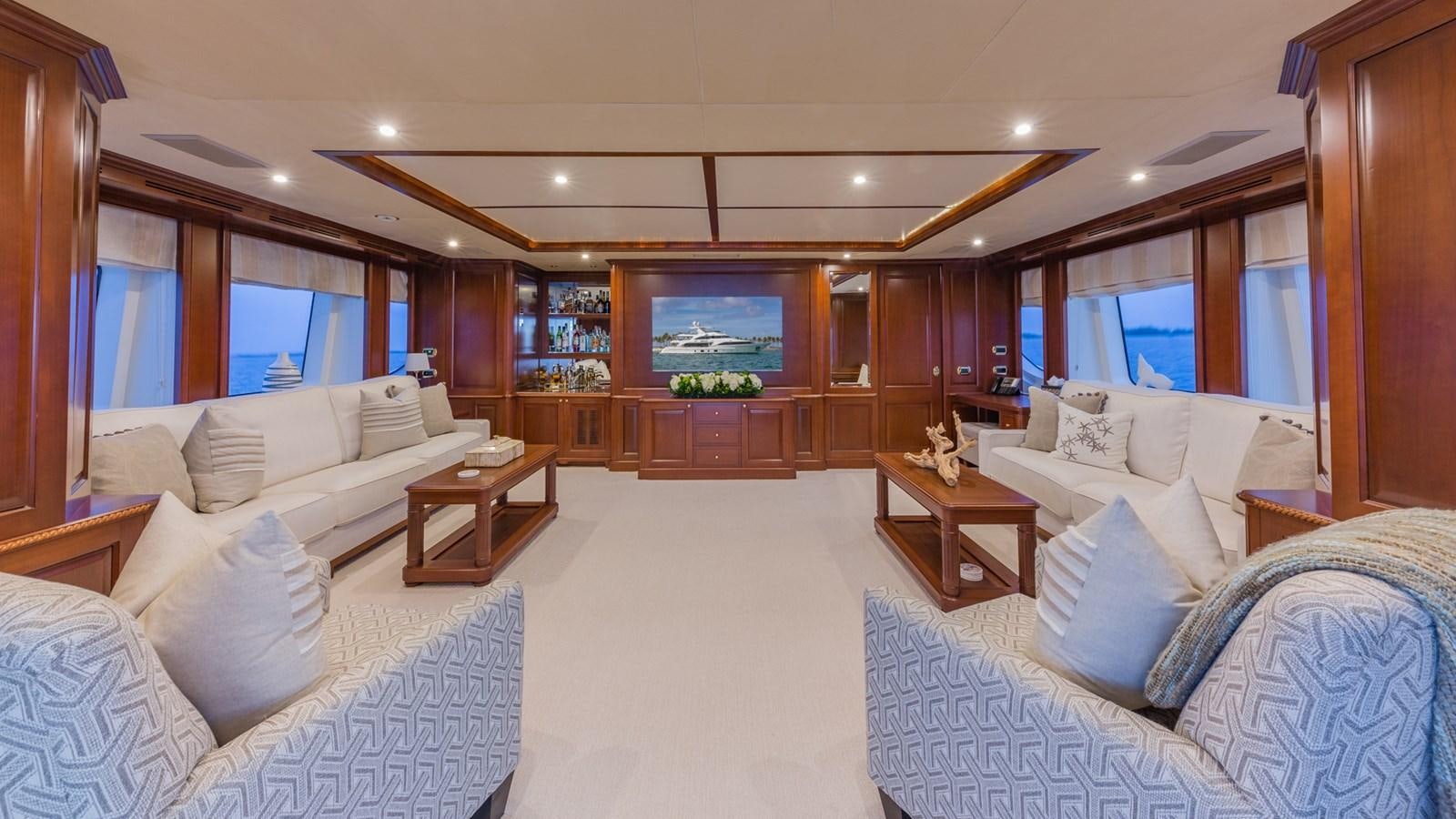 a large living room with a large window aboard NAMASTE Yacht for Sale