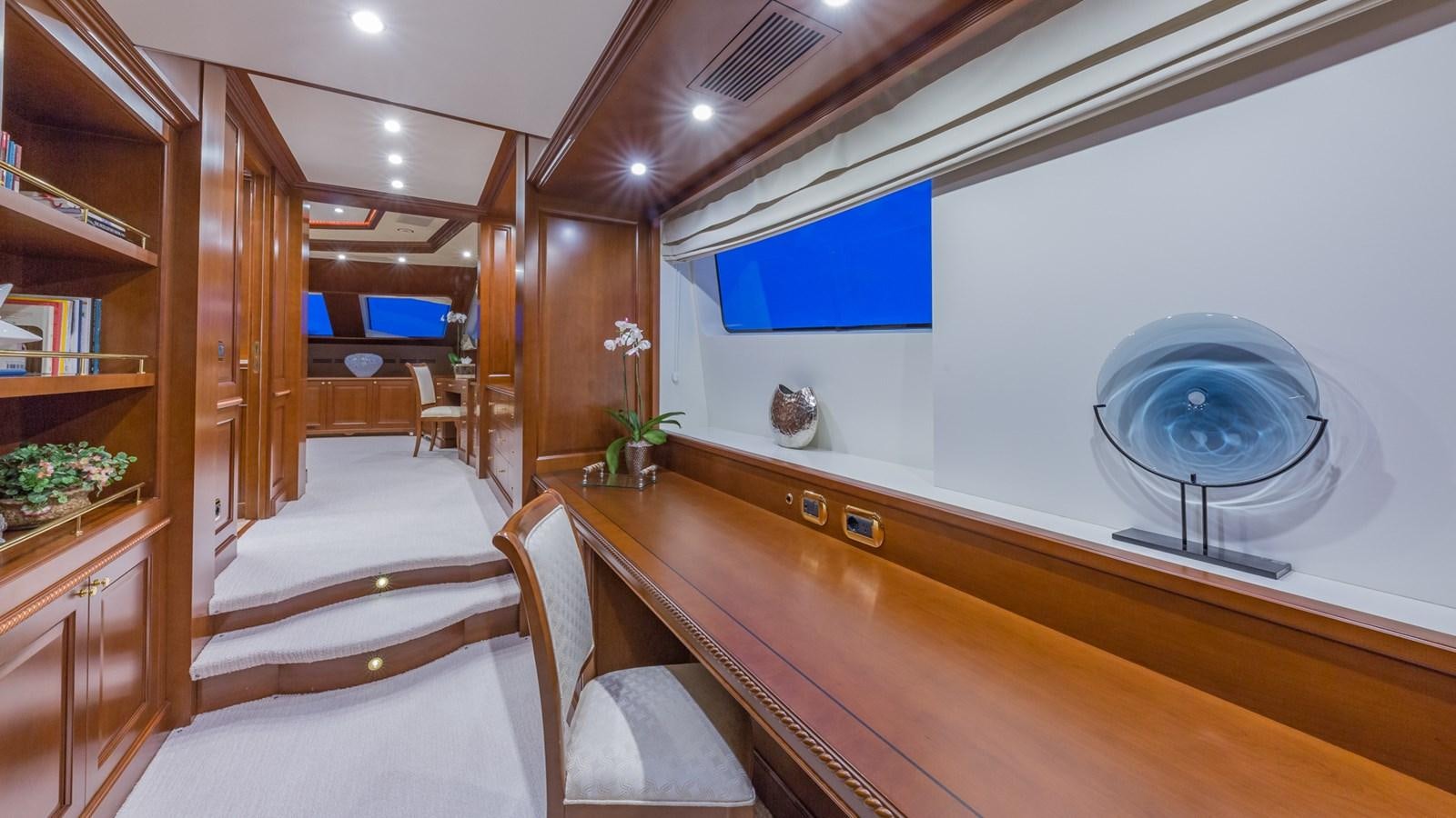 a room with a table and chairs aboard NAMASTE Yacht for Sale