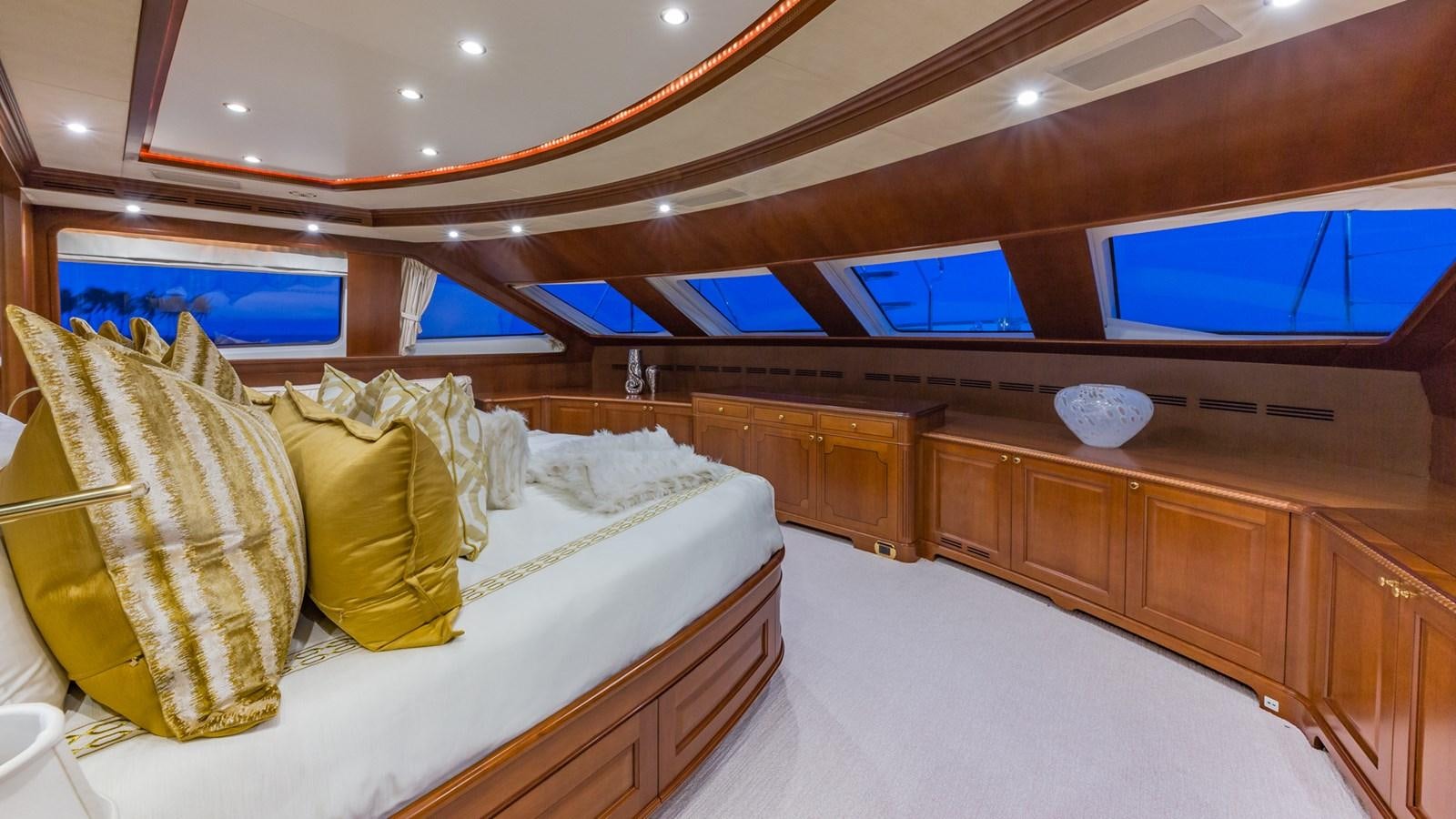 a room with a bed and a tv aboard NAMASTE Yacht for Sale
