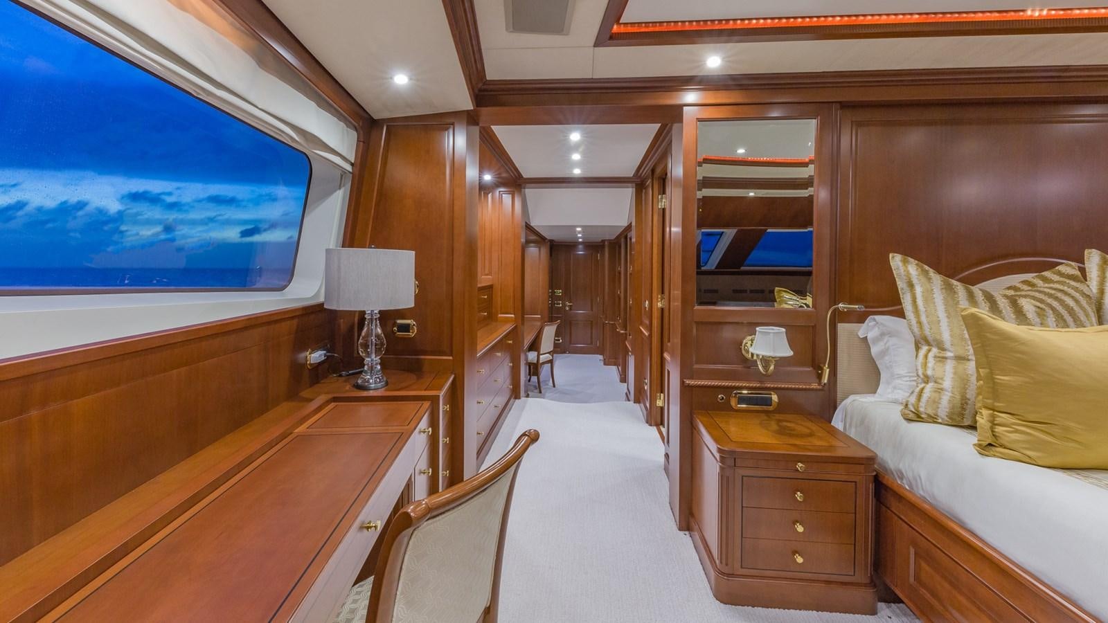 a room with a bed and a tv aboard NAMASTE Yacht for Sale