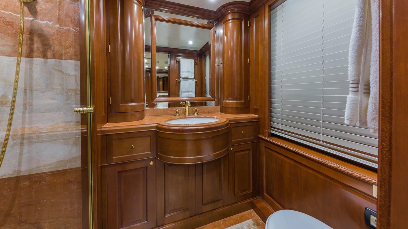 a bathroom with a sink and a mirror aboard NAMASTE Yacht for Sale
