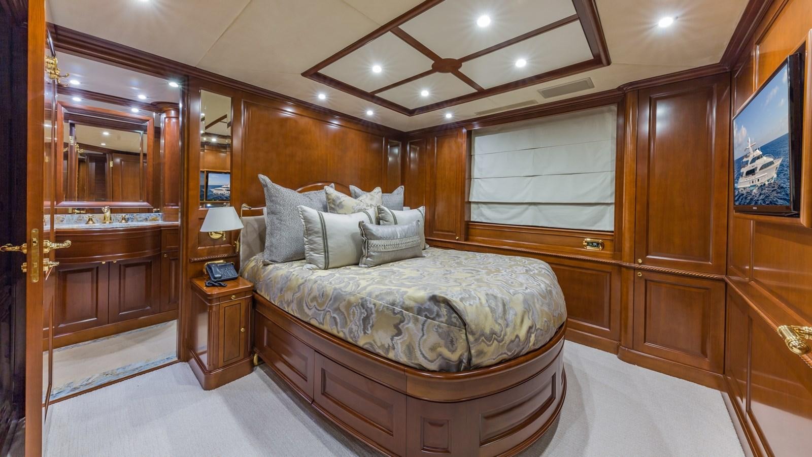 a bed in a room aboard NAMASTE Yacht for Sale