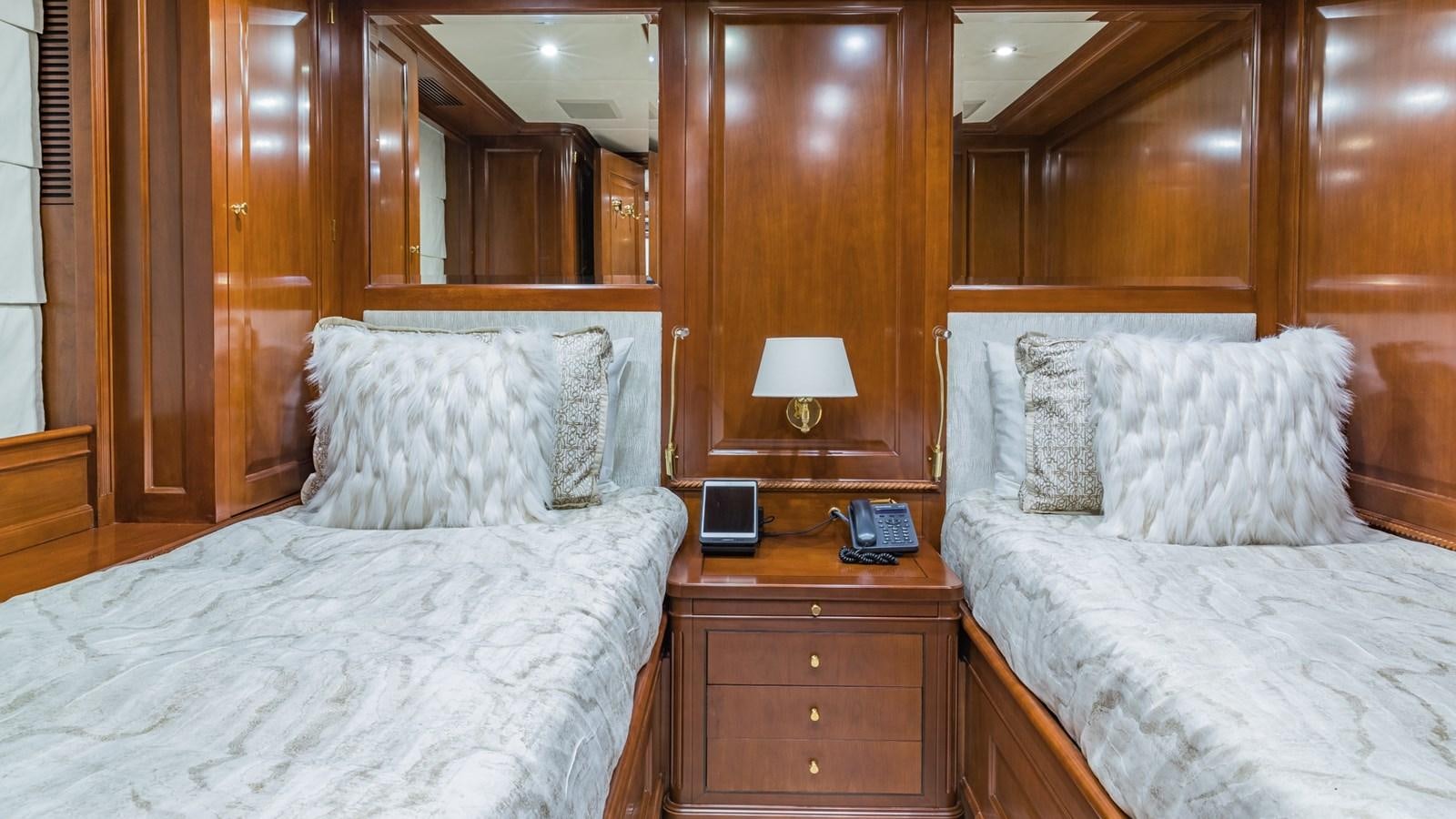 a couple of beds in a hotel room aboard NAMASTE Yacht for Sale