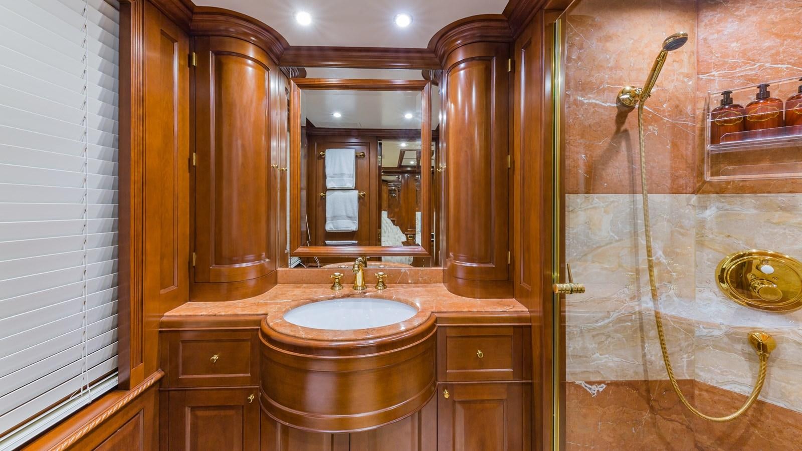 a bathroom with a sink and a mirror aboard NAMASTE Yacht for Sale