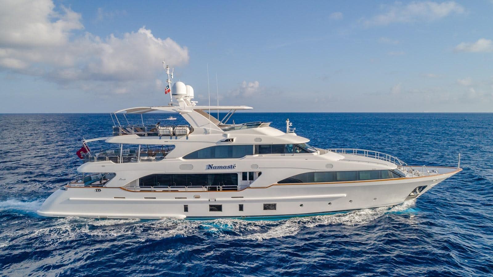 a white yacht in the ocean aboard NAMASTE Yacht for Sale