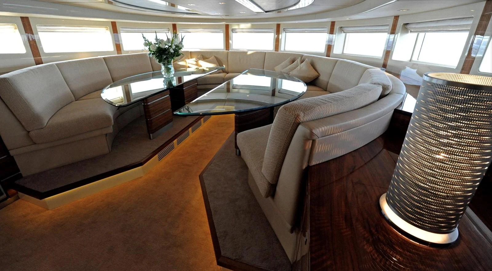 a room with a table and chairs aboard BASMALINA II Yacht for Sale