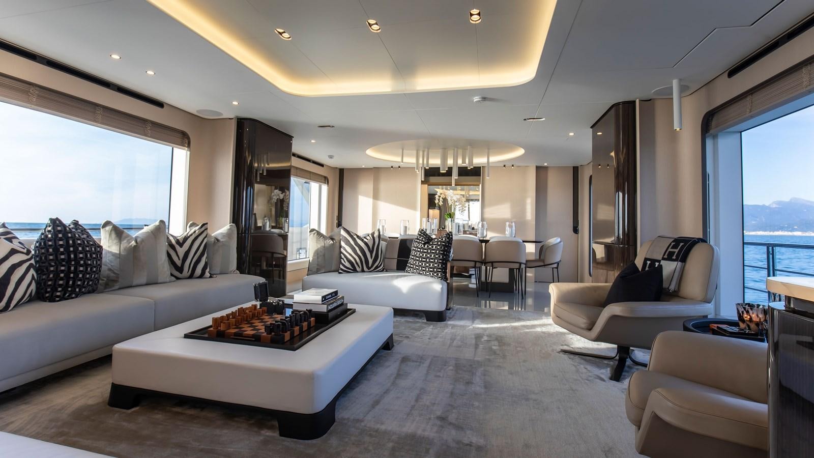 a living room with a large window aboard H Yacht for Sale